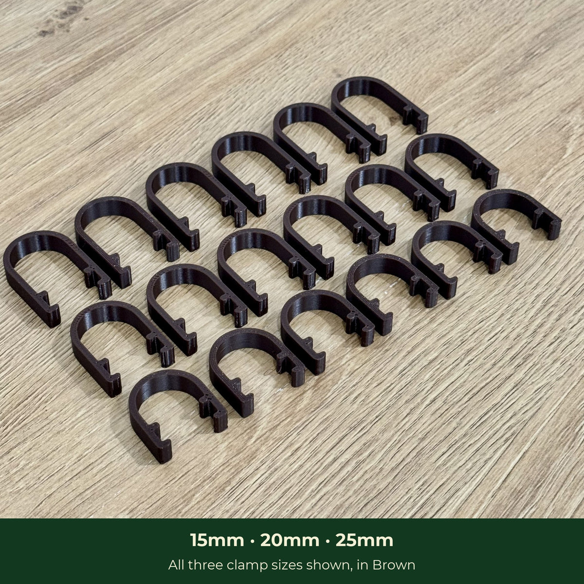 Three sizes of ModuMoss plant clamps laid out at an angle