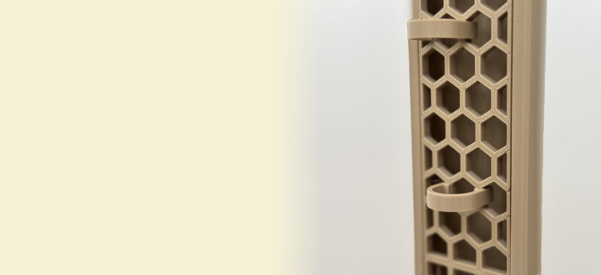 Close-up of a ModuMoss honeycomb moss pole with plant clamps