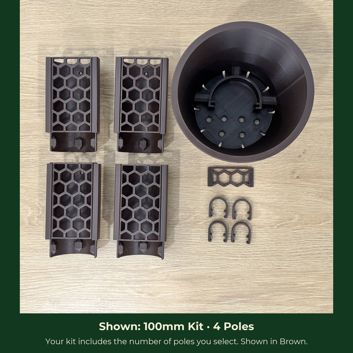 ModuMoss 100mm kit laid out with 4 poles, anchor pot, face plate and clamps, in brown