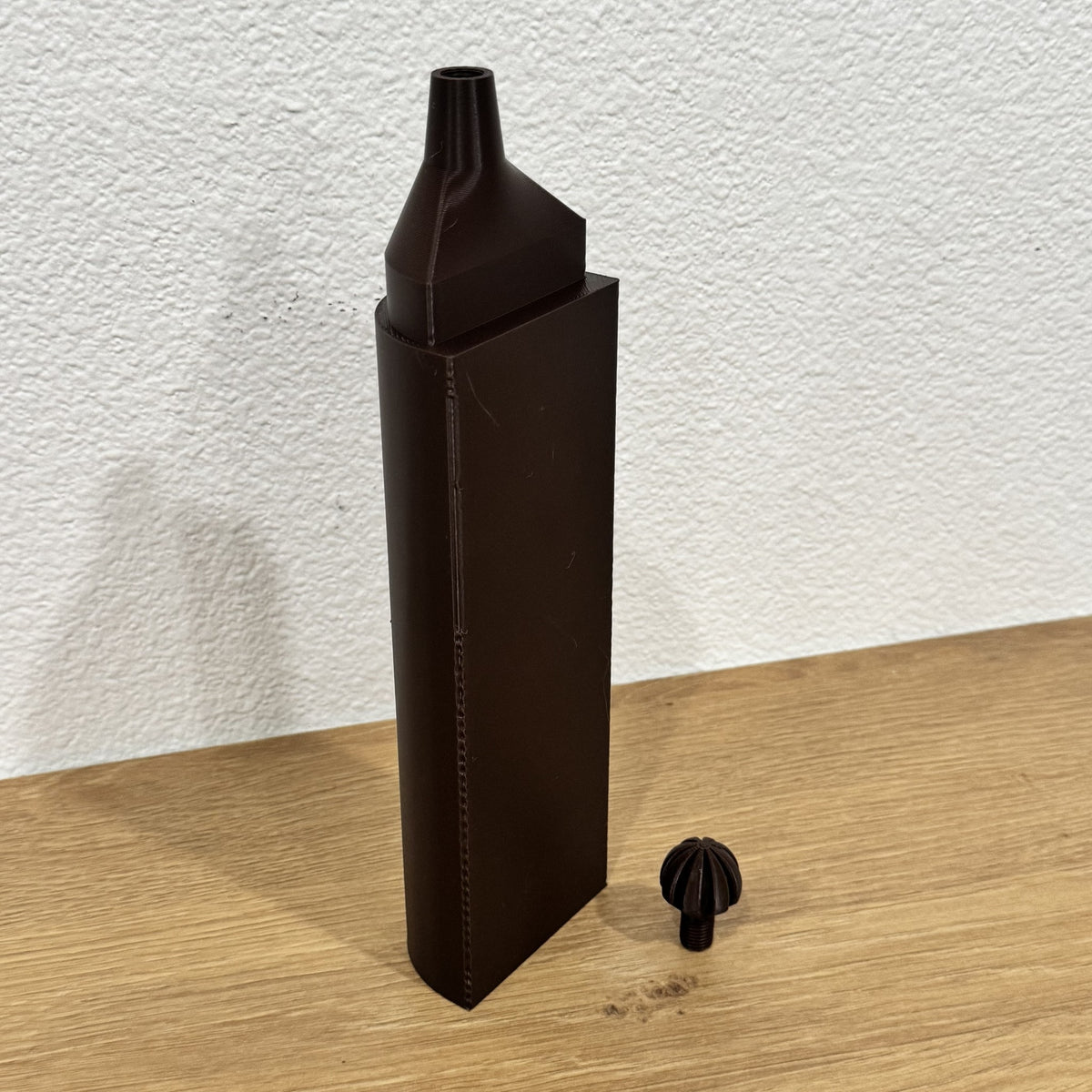 Brown ModuMoss watering tank with drip cap